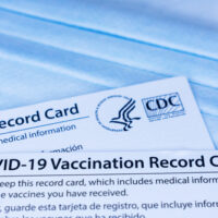 Closeup.,Covid-19,Vaccination,Record,Cards,Issued,By,Cdc,,United,States